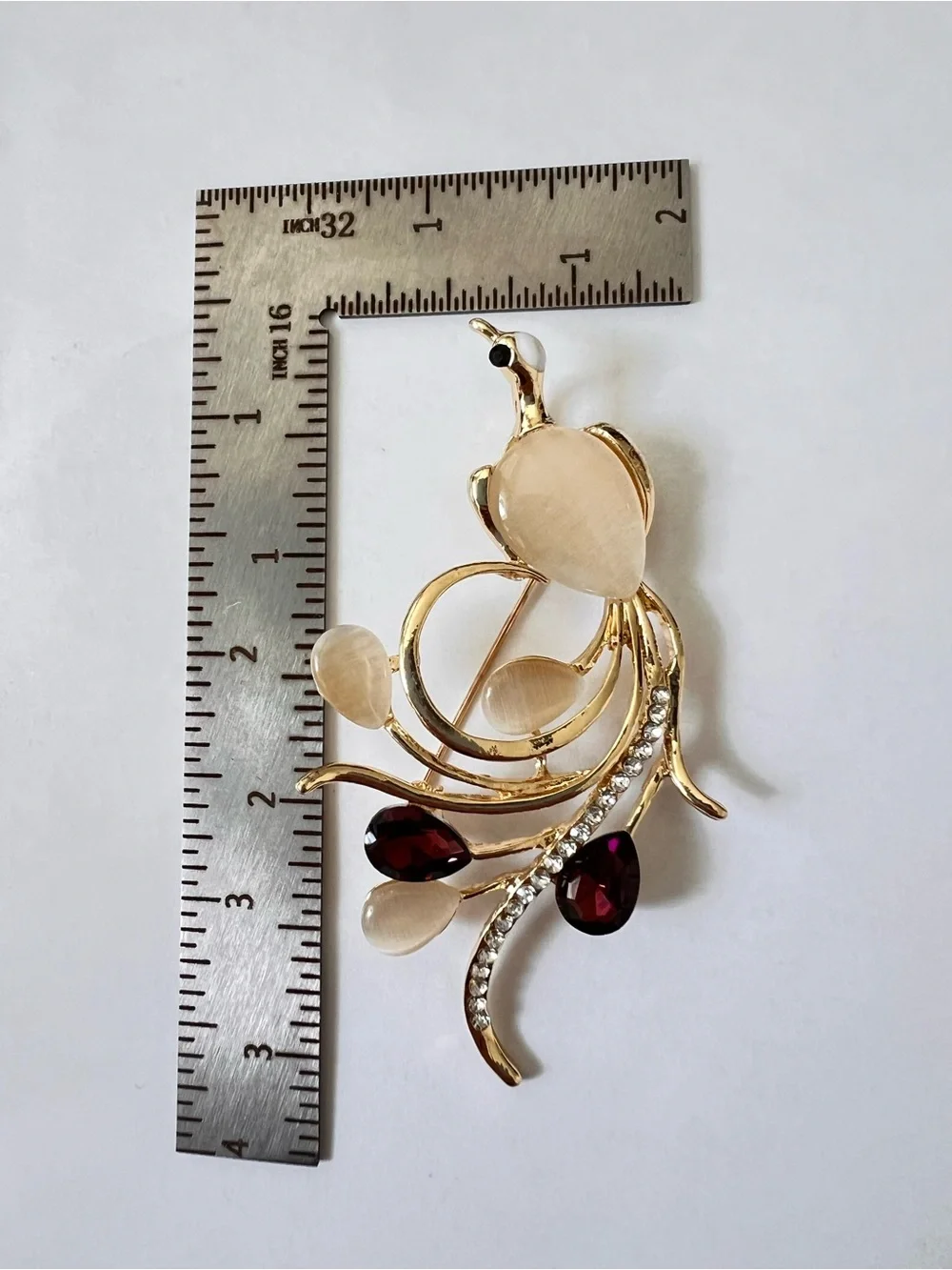 Gold-Tone Floral Bird Brooch with Champagne and Garnet Stones